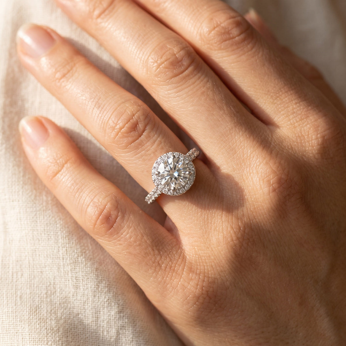 1.10 ct Round Diamond Halo Engagement Ring in 14K White Gold, worn