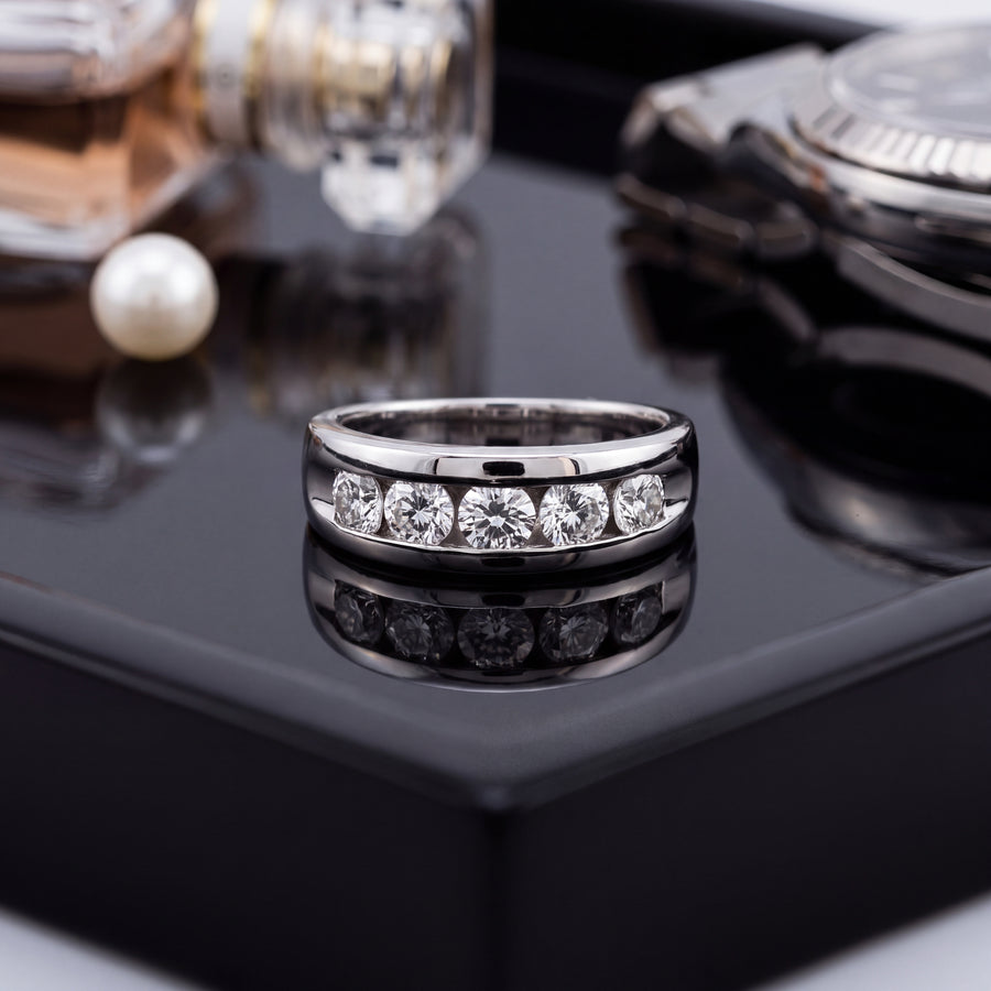 Polished platinum band with five round diamonds channel-set across the top