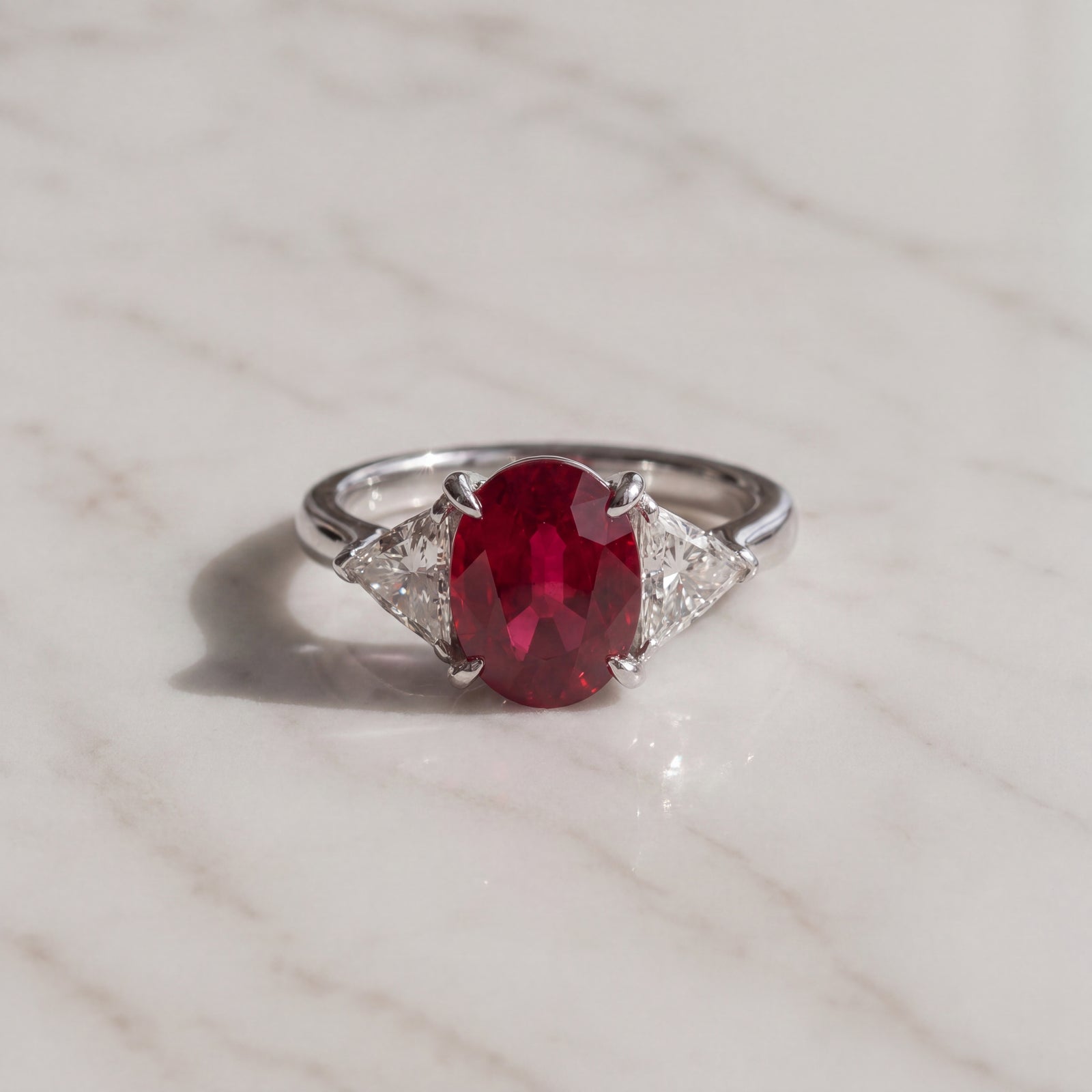 Oval Pigeon Blood Ruby Three-Stone Ring in White Gold