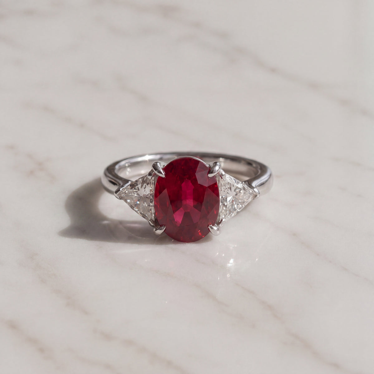 Oval Pigeon Blood Ruby Three-Stone Ring in White Gold