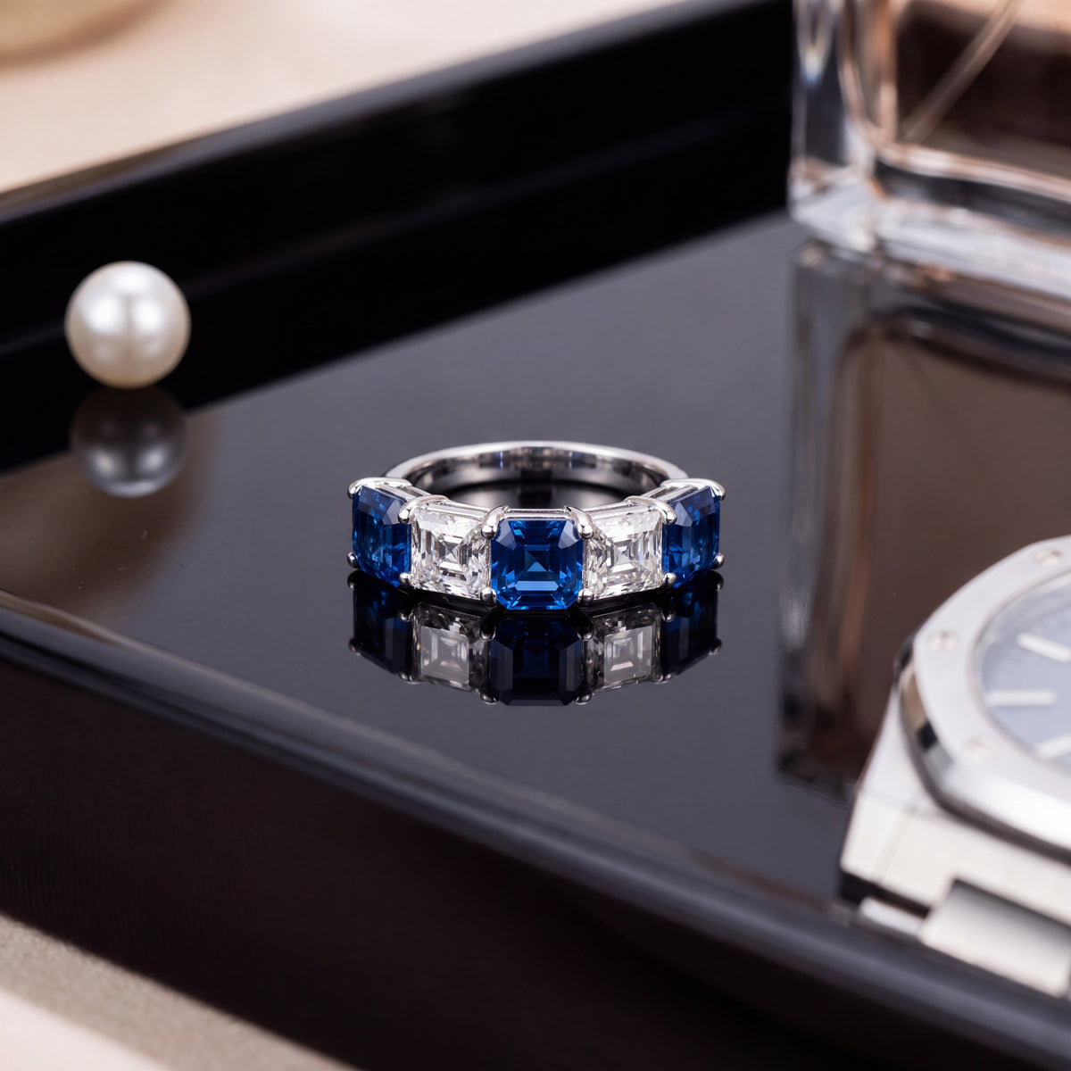 Five-stone ring of square blue sapphires and diamonds