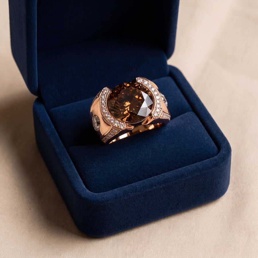 Wide rose gold men's ring with a round brown diamond center framed by curved white diamond rows