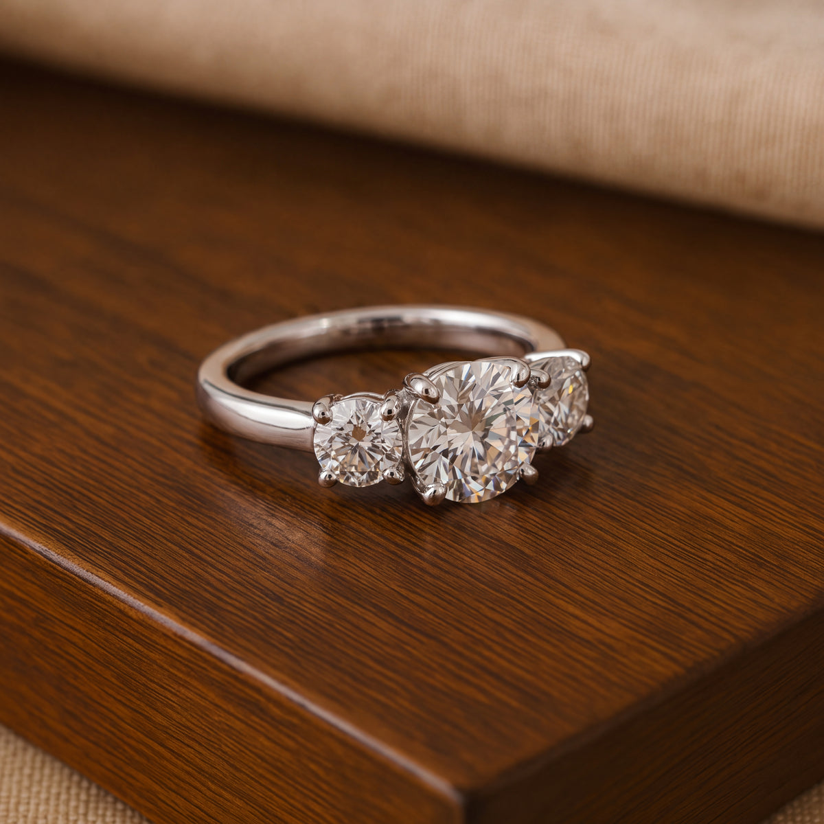White gold ring of three round diamonds in prongs