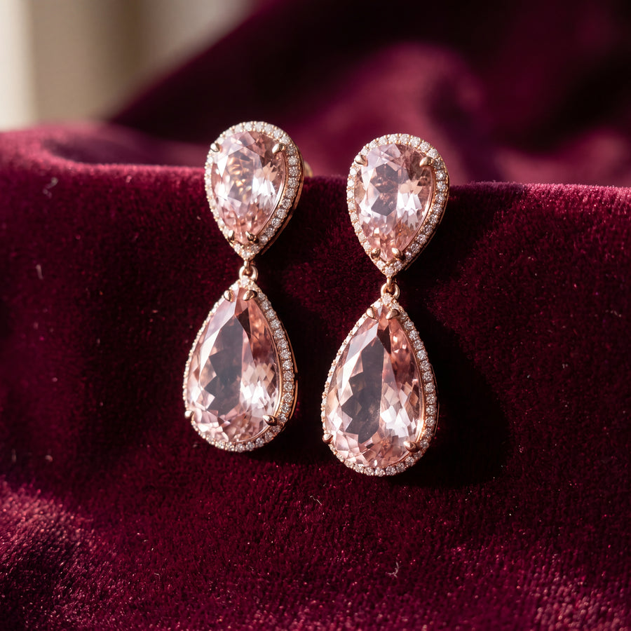 Rose gold double drop earrings with two pear-shaped morganites per earring, each in a diamond halo
