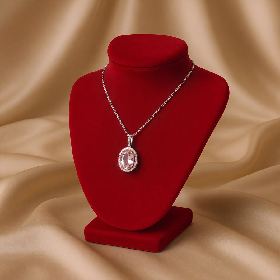 Oval morganite pendant with a diamond halo and pave bail in 14K rose gold on a cable chain