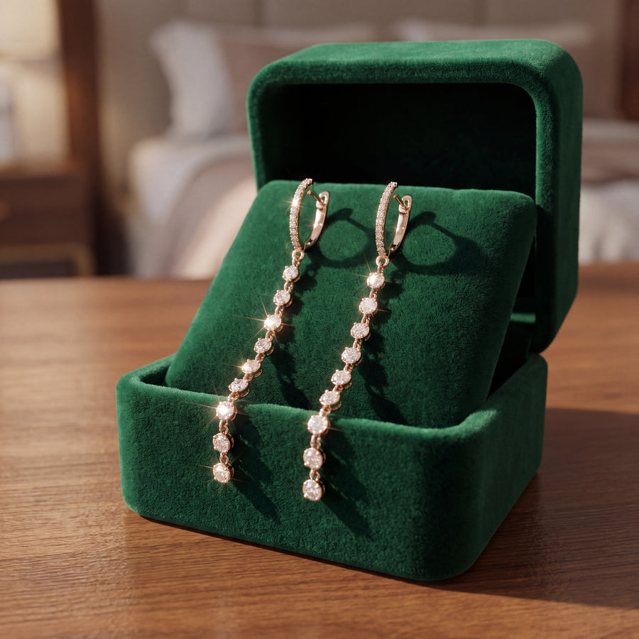 Yellow gold drop earrings, a line of round diamonds below a small hoop