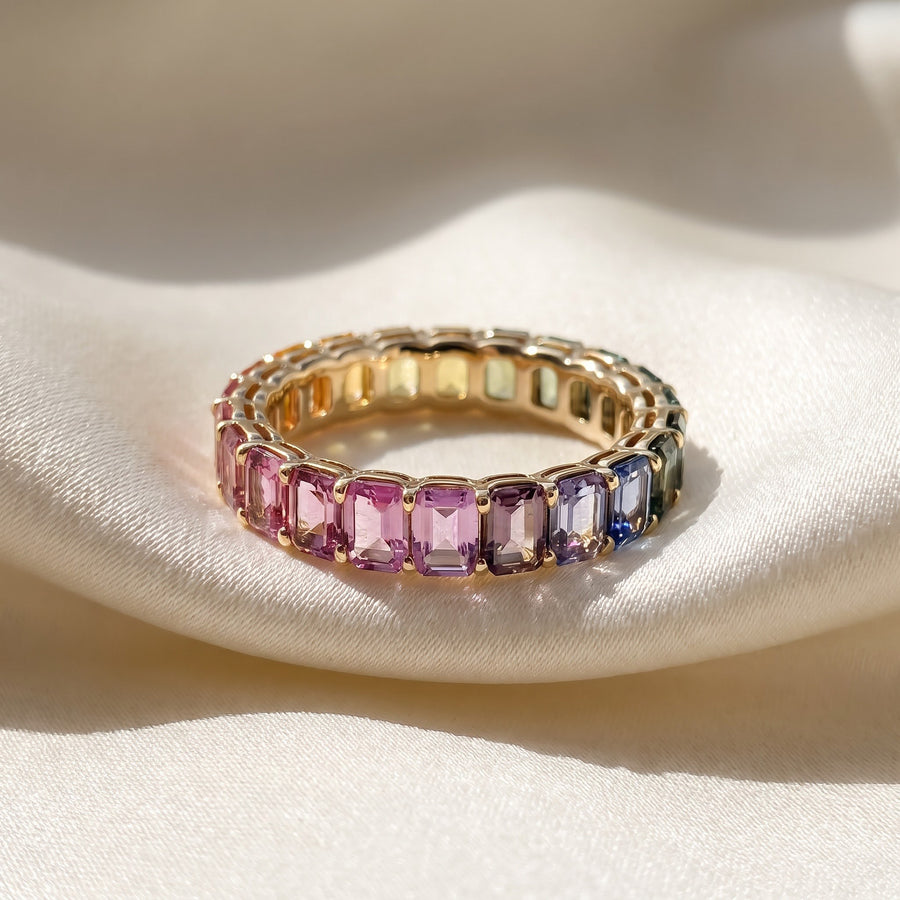 Emerald-Cut Multi-Color Sapphire Eternity Ring in Yellow Gold