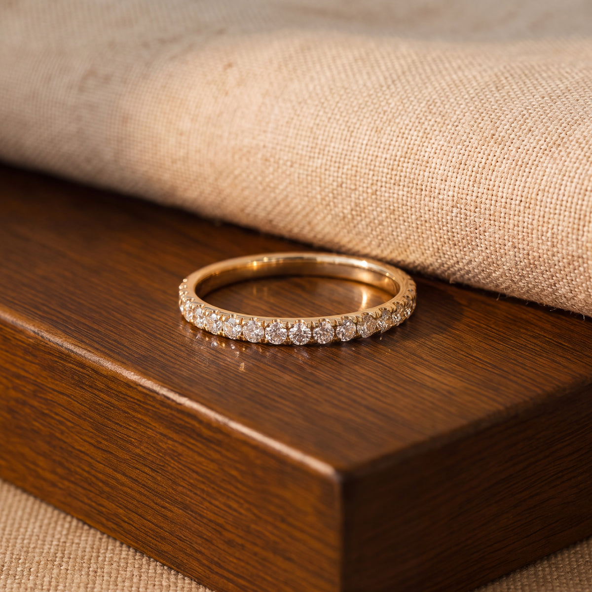 Slender eternity ring with a continuous row of round diamonds set closely along the top