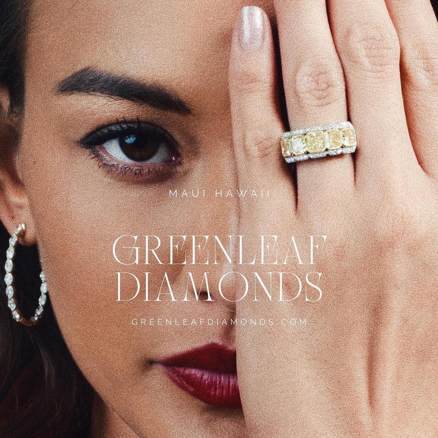 A yellow diamond band and diamond hoop earrings worn by a model