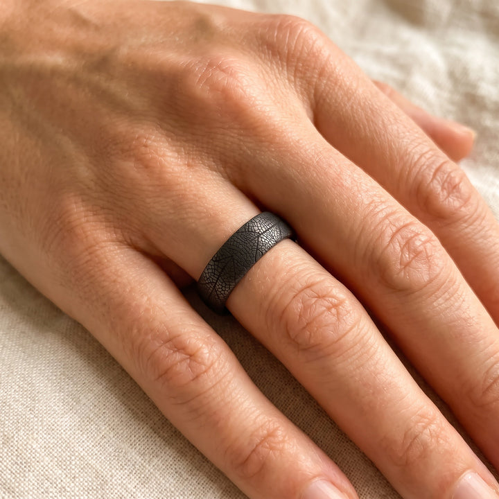 Matte Tantalum Band Ring with Leaf Vein Pattern, worn