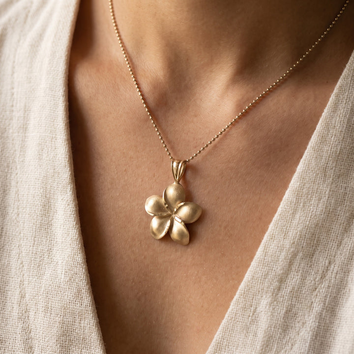 Matte Flower Pendant Necklace in 14K Yellow Gold, worn
