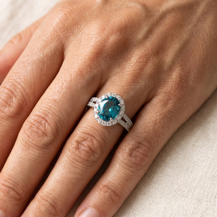 4.45 ct Oval Blue Zircon and Diamond Halo Cocktail Ring in 14K White Gold, worn