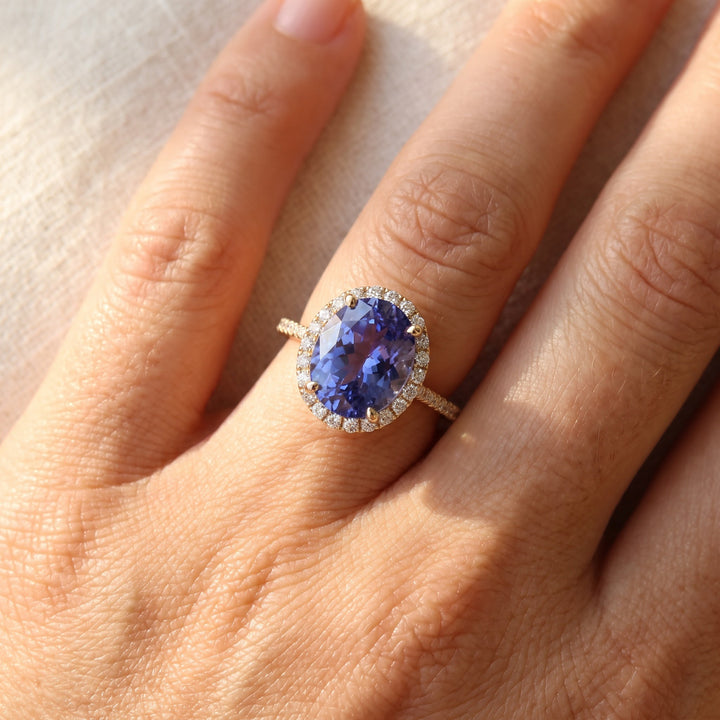 Oval Tanzanite Halo Cocktail Ring in Yellow Gold, worn