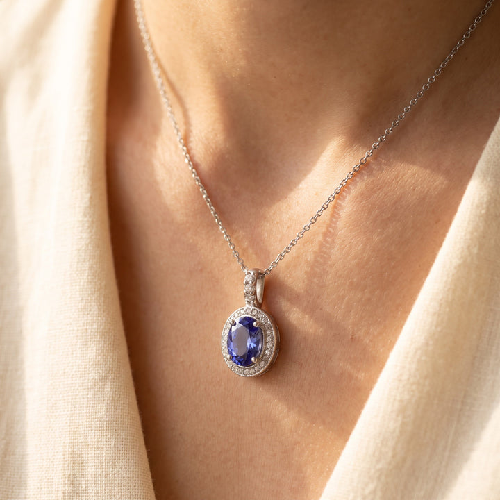 2.24 ct Oval Tanzanite and Diamond Halo Pendant Necklace in 14K White Gold, worn
