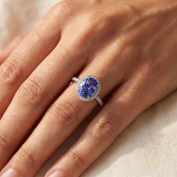 2.12 ct Oval Tanzanite and Diamond Halo Ring with Pavé Band in 14K White Gold, worn