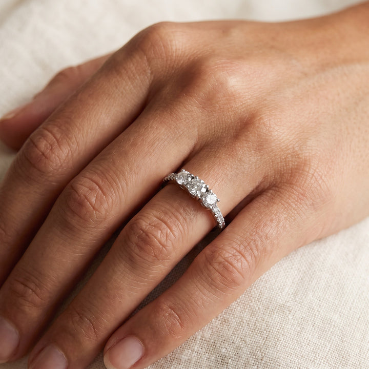 White Gold Three-Stone Diamond Ring with Pavé Band, worn