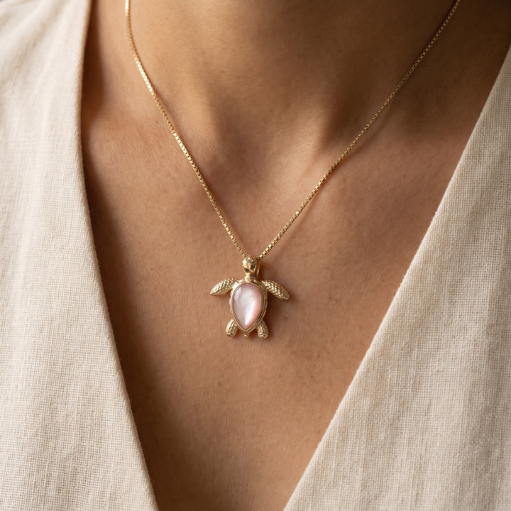 Mother of Pearl Sea Turtle Charm Necklace in 14K Yellow Gold, worn