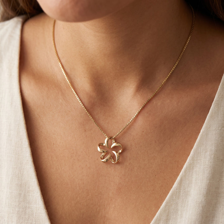 Open Petal Floral Charm Necklace in 14K Yellow Gold, worn