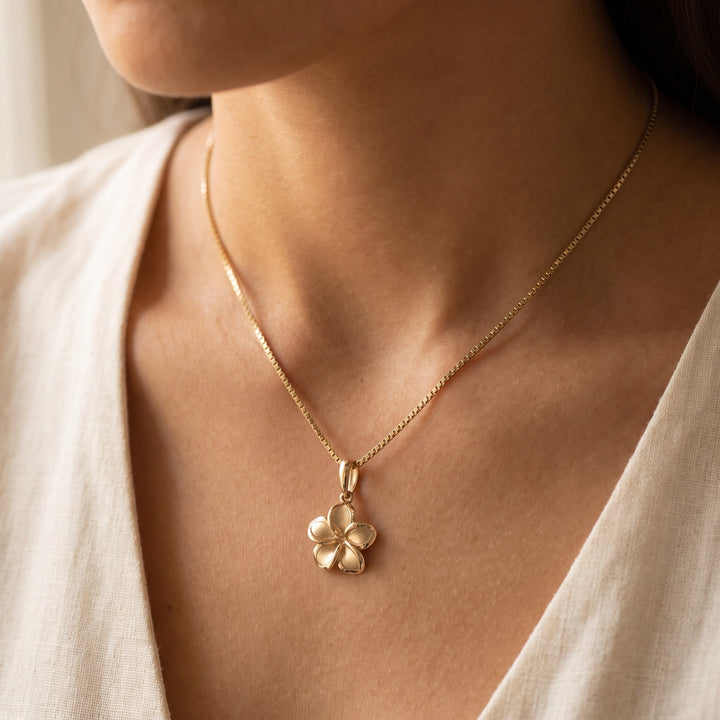Plumeria Pendant Necklace on a Box Chain in 14K Yellow Gold, worn