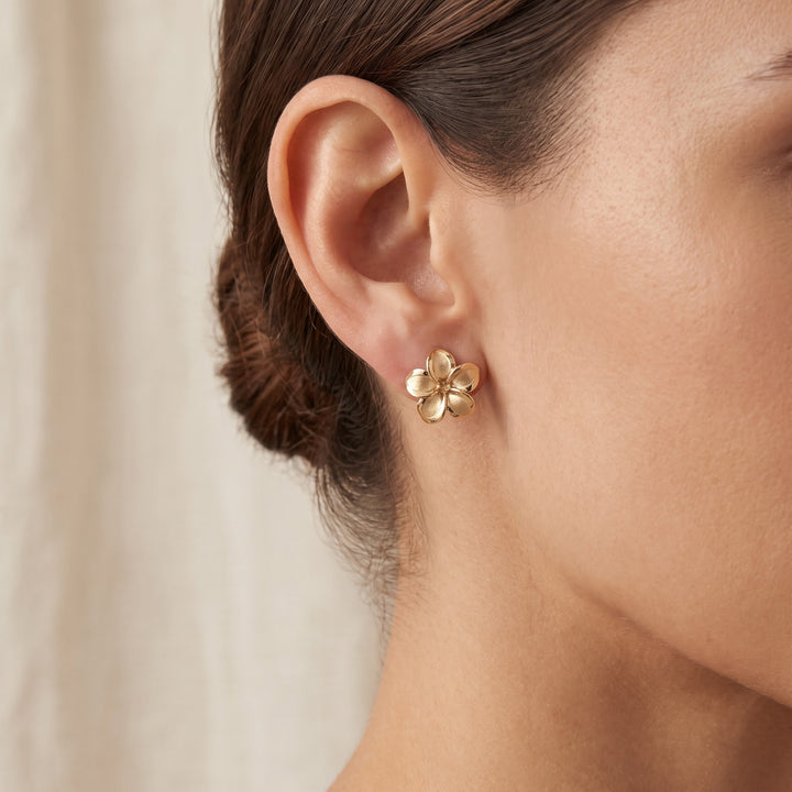 Textured Plumeria Stud Earrings in 14K Yellow Gold, worn