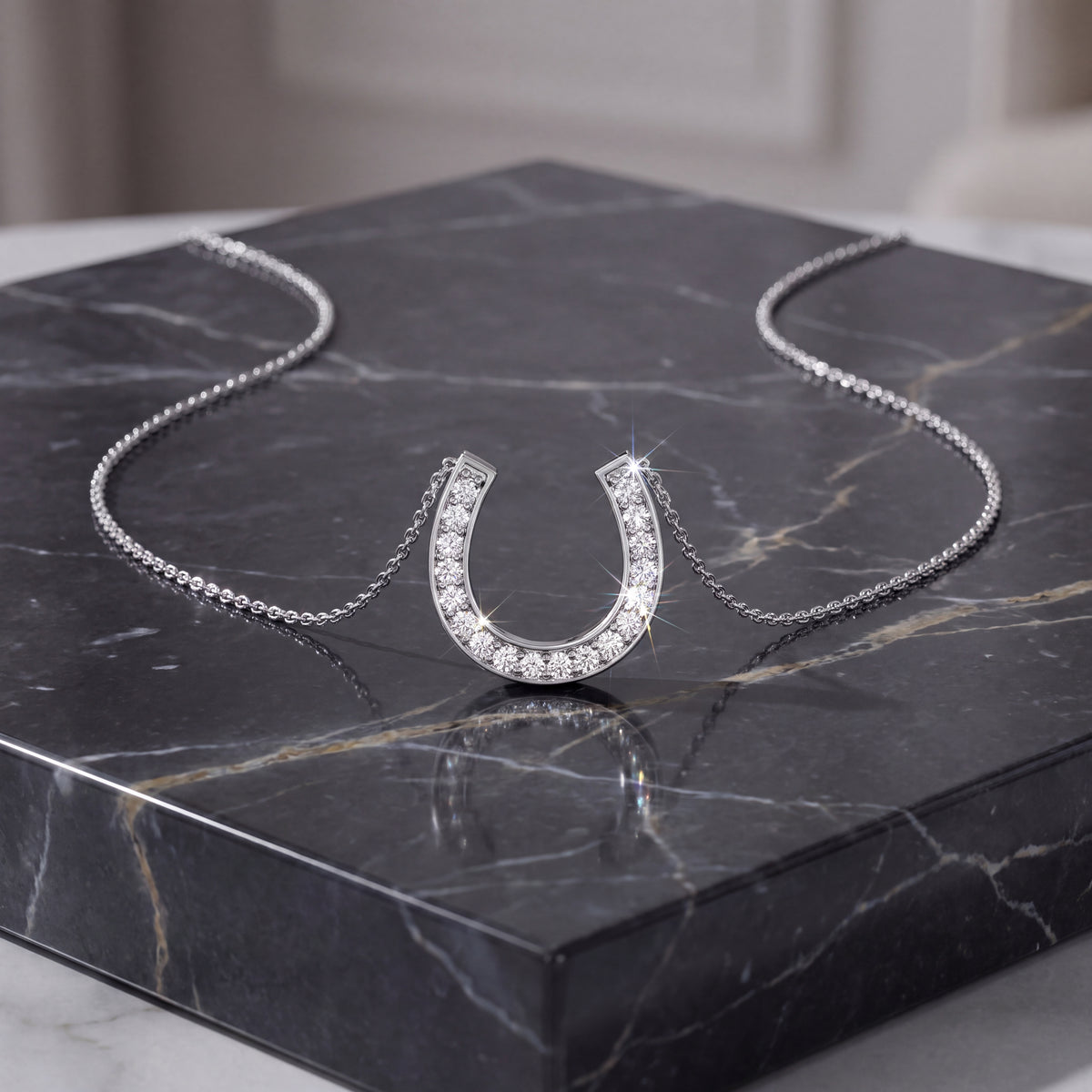 Diamond-set horseshoe pendant on a white gold chain