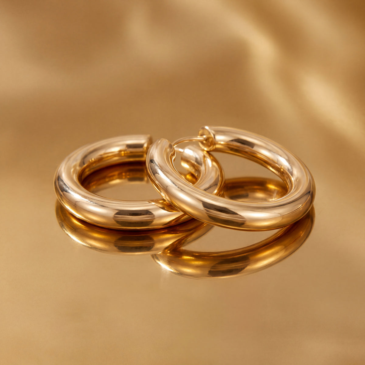 Pair of chunky polished yellow gold hoop earrings