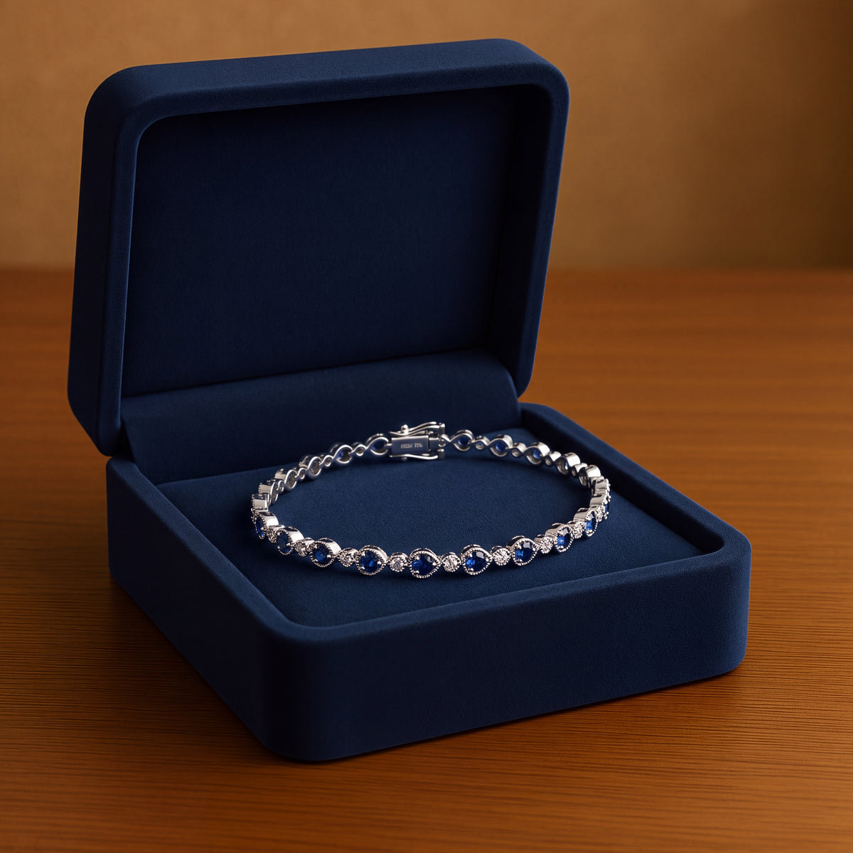 White gold tennis bracelet of sapphires and diamonds