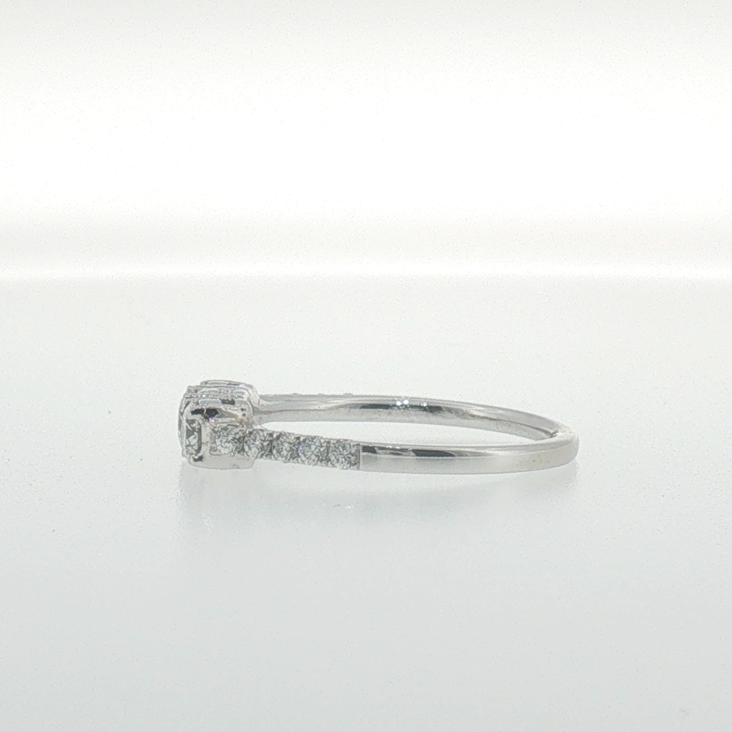 White Gold Three-Stone Diamond Ring with Pavé Band