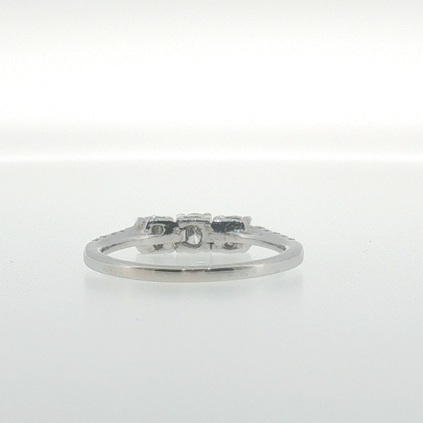 White Gold Three-Stone Diamond Ring with Pavé Band