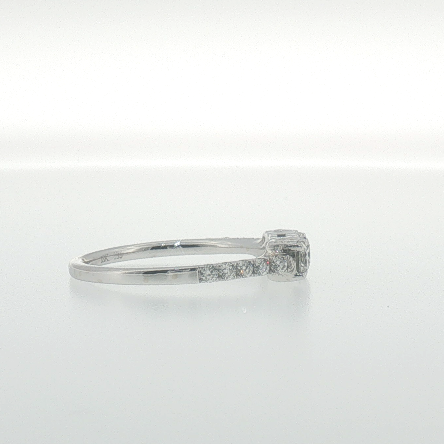 White Gold Three-Stone Diamond Ring with Pavé Band