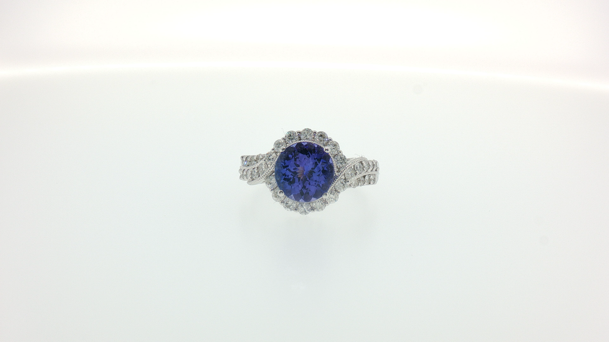 Tanzanite Twist Halo Cocktail Ring in White Gold