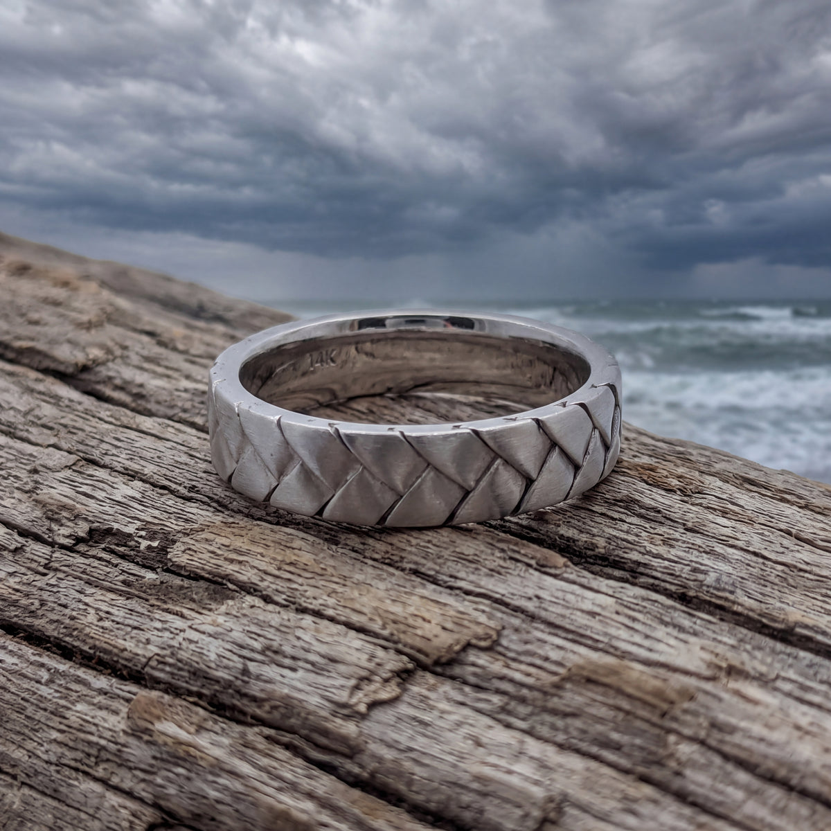White gold band with a woven pattern