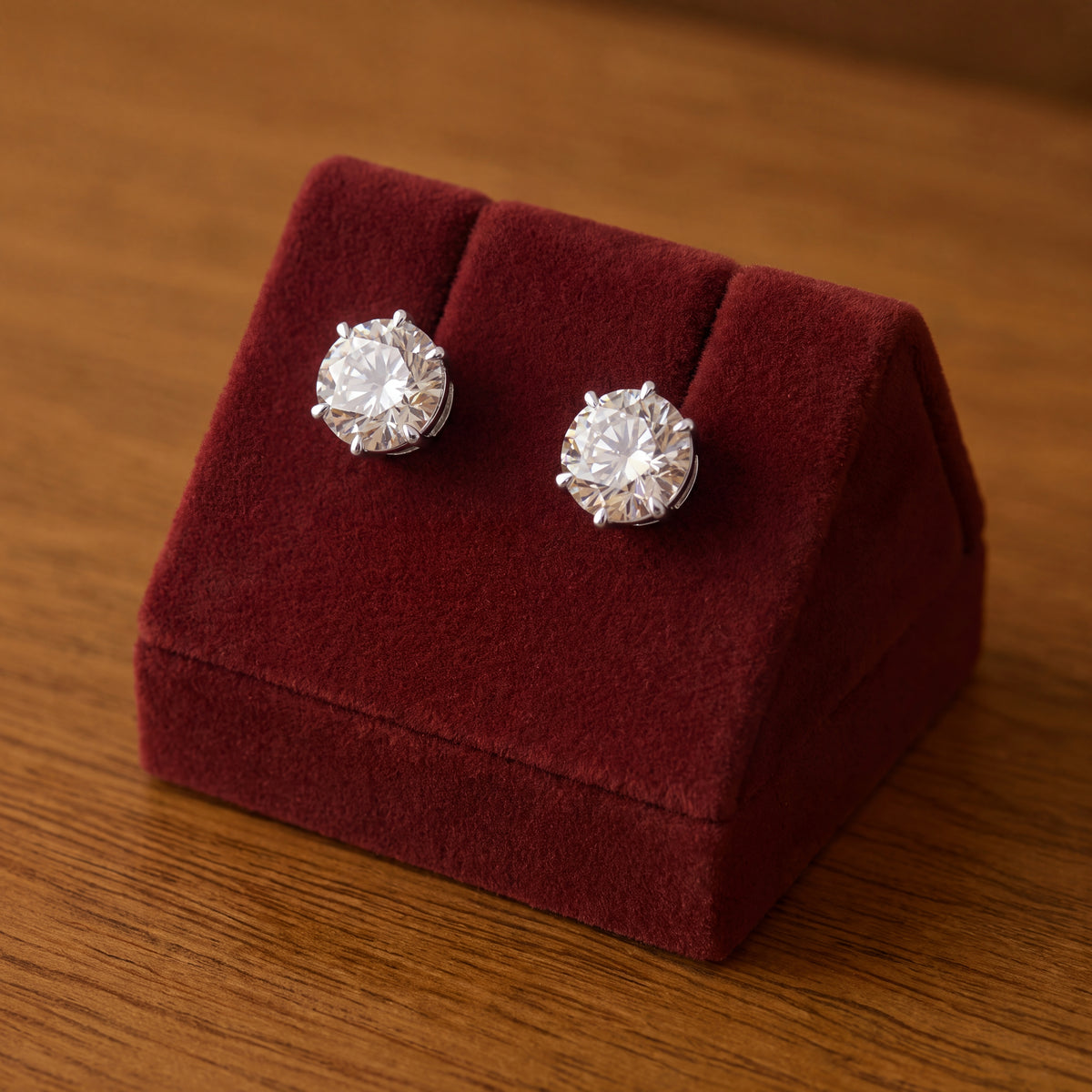 Pair of round diamond stud earrings in white gold