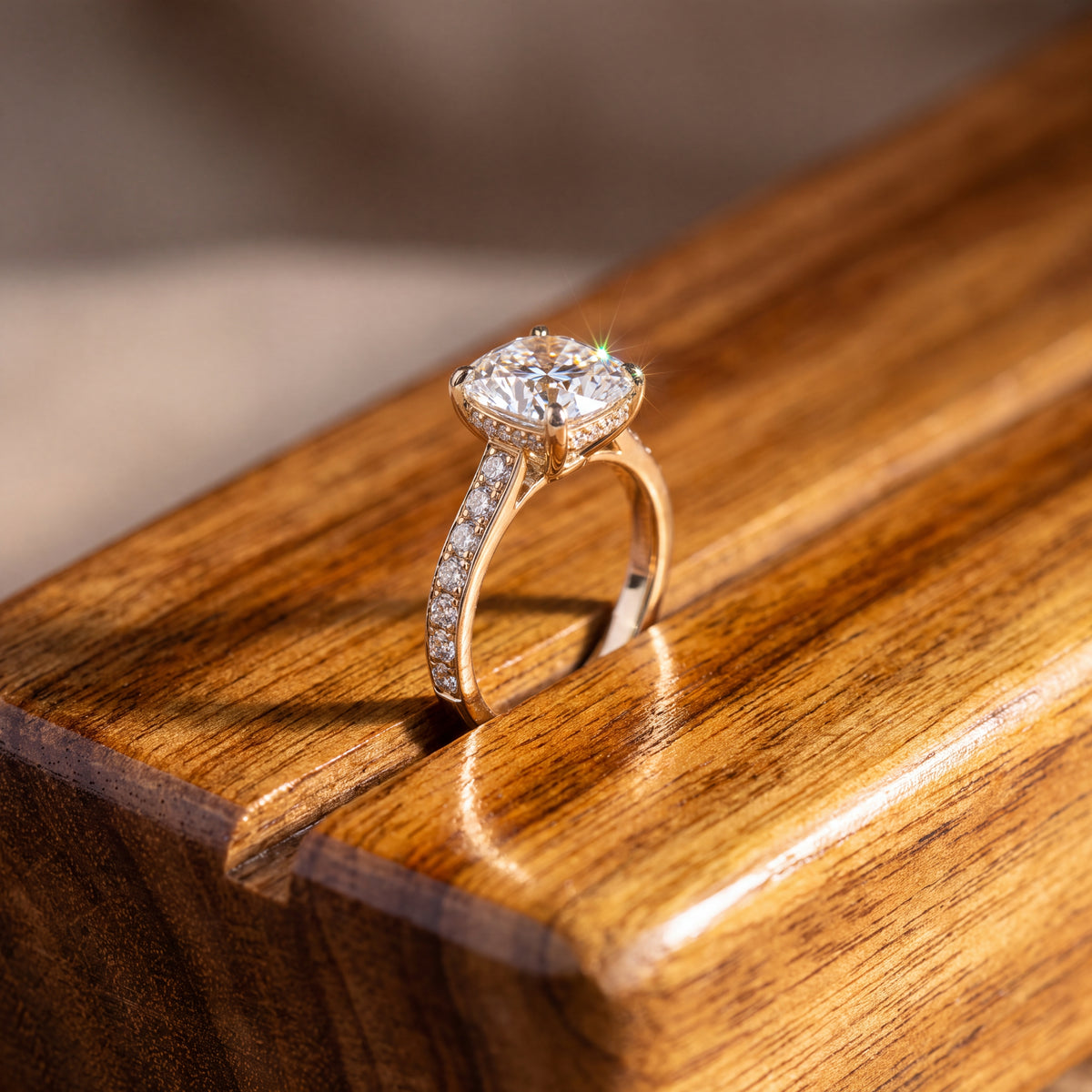 Cushion-cut diamond ring on a band lined with small diamonds