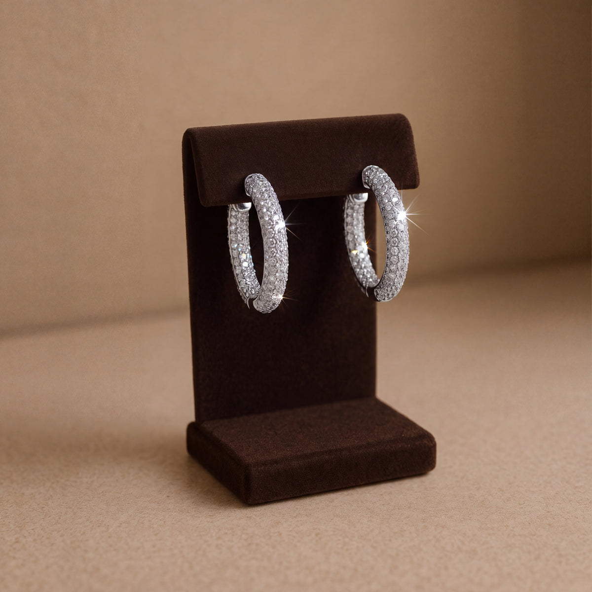 Rounded white gold hoops encrusted with pavé diamonds