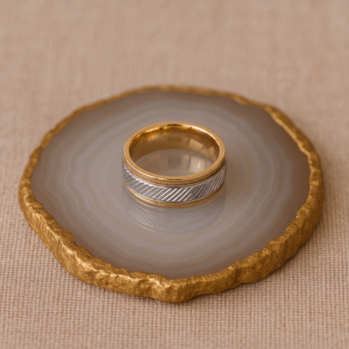 Yellow gold band with a diagonal textured white gold center