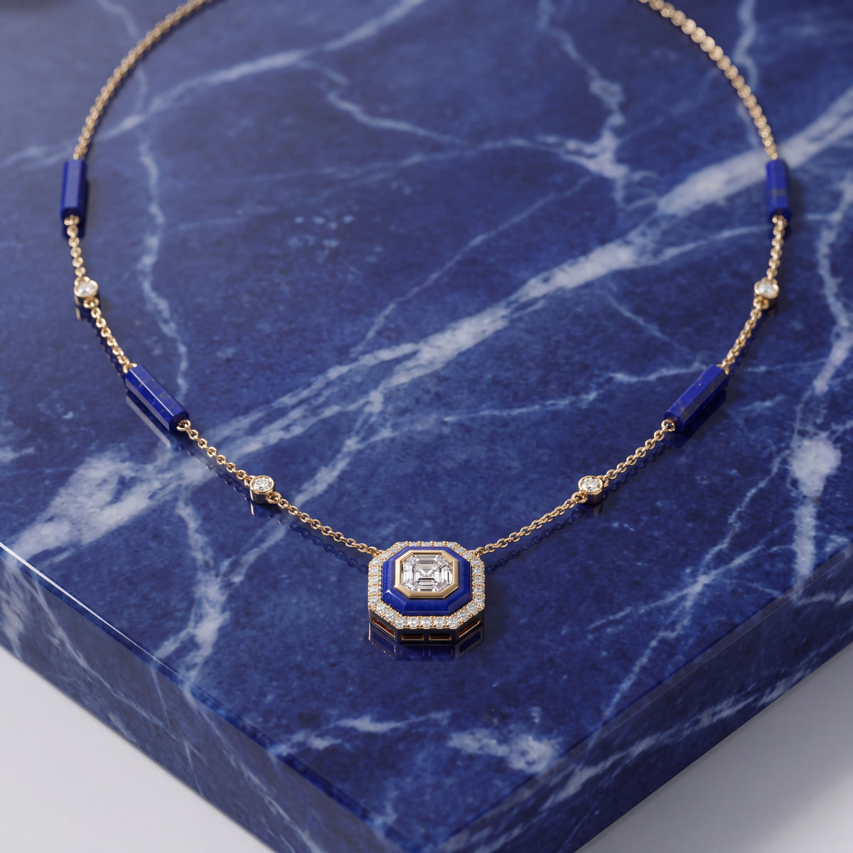 Yellow gold necklace with lapis lazuli stations and an octagonal pendant