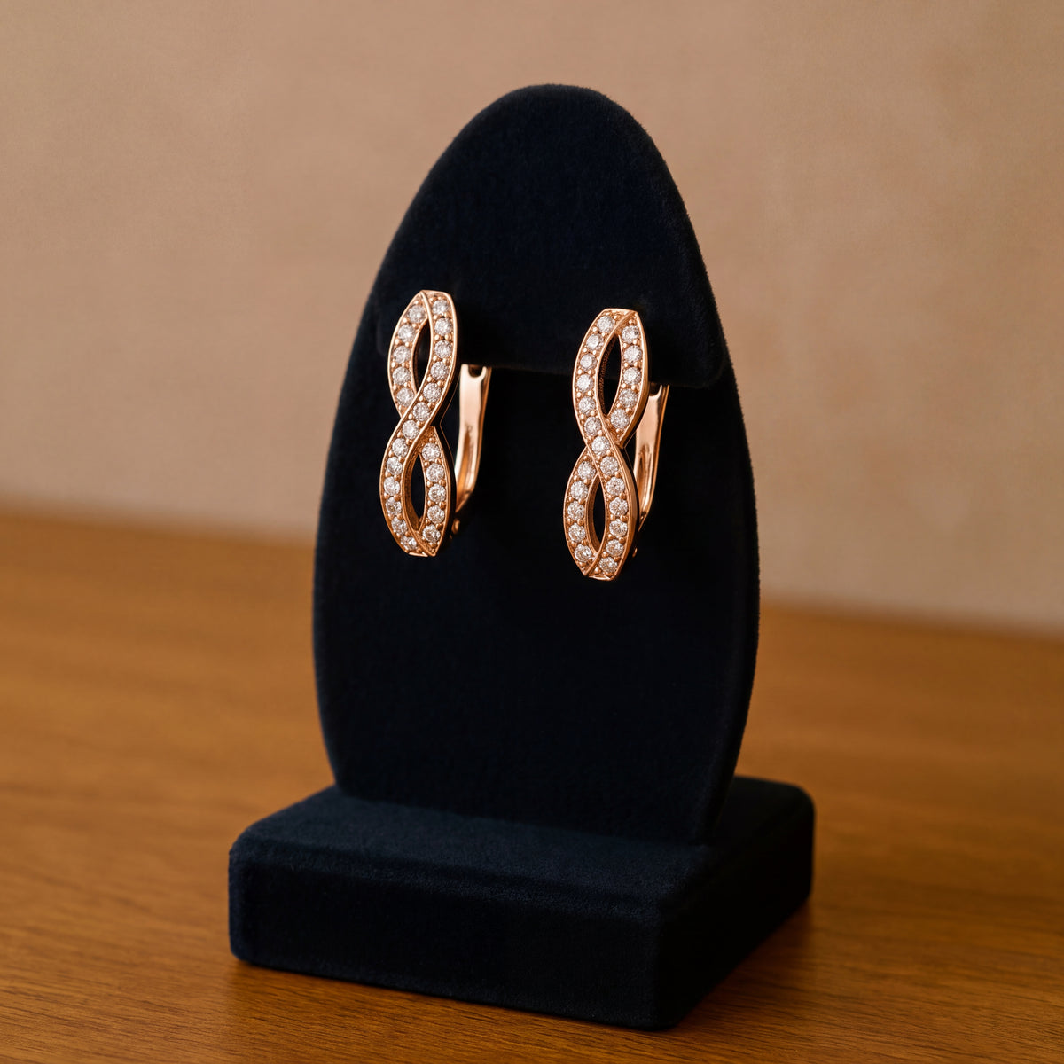Rose gold infinity twist clip-on earrings with pavé diamonds