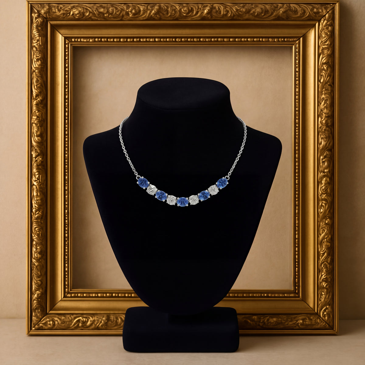 White gold necklace with a curved bar of sapphires and diamonds