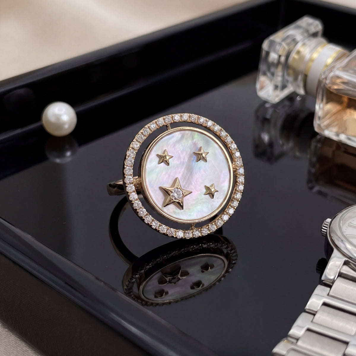 Yellow gold ring with a mother-of-pearl star dial in a diamond halo
