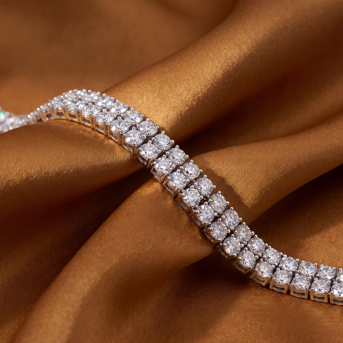 Double row tennis bracelet of prong-set round diamonds in white gold