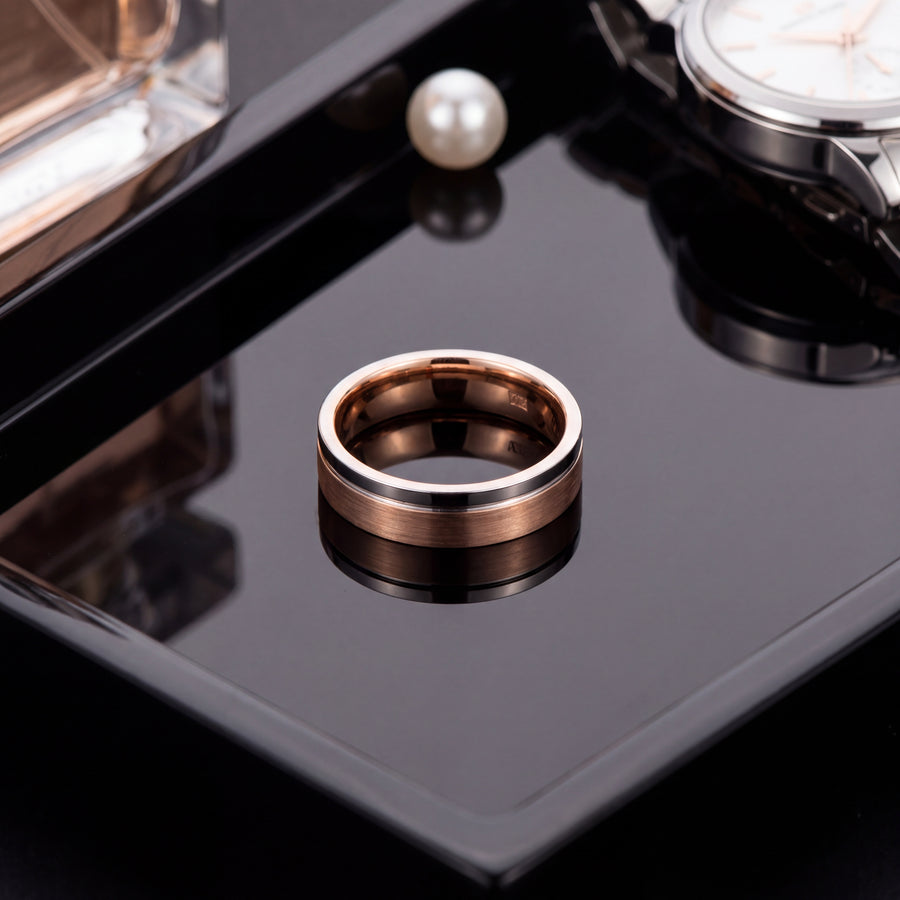 Flat band ring in brushed 14K rose gold with a thin polished white gold edge