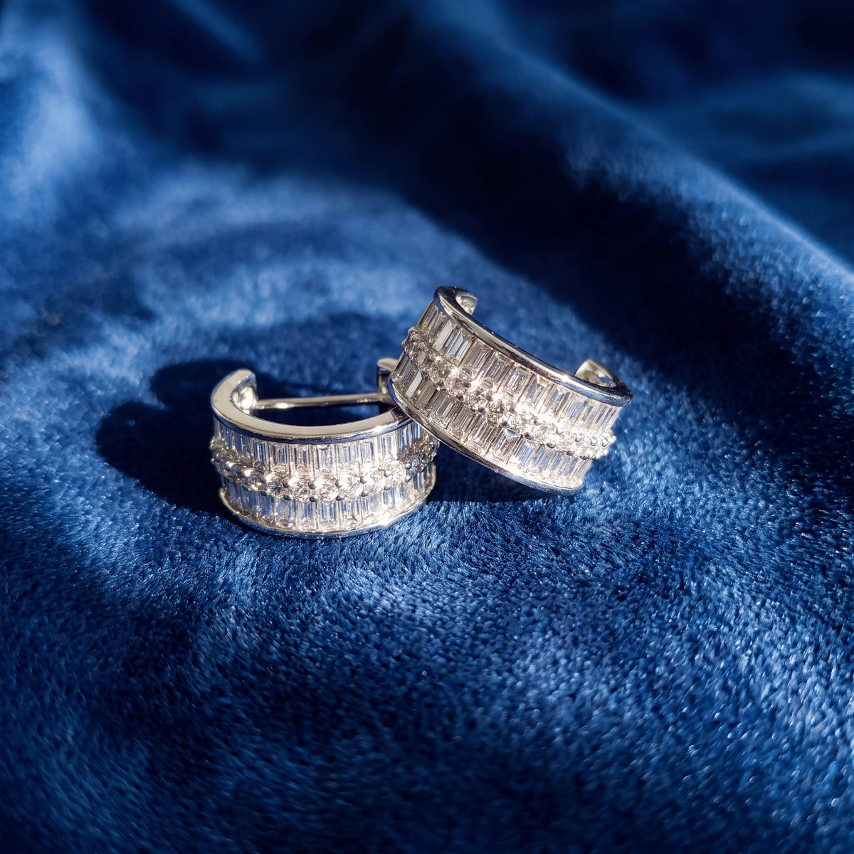 White gold hoop earrings of baguette and round diamonds