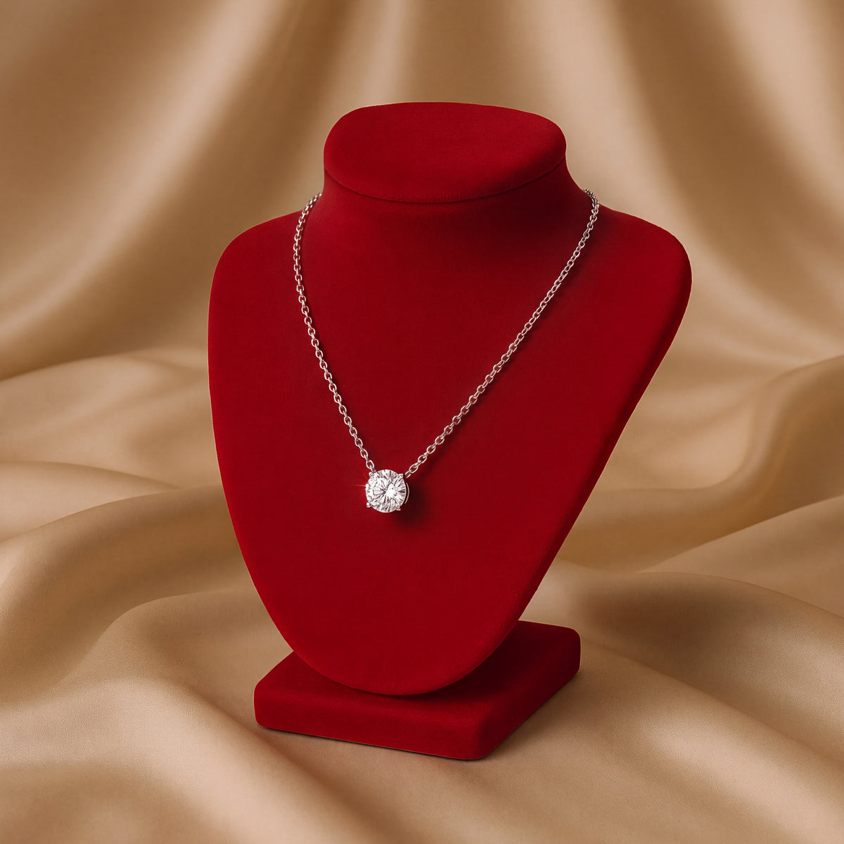 Round diamond solitaire in four prongs on a white gold chain
