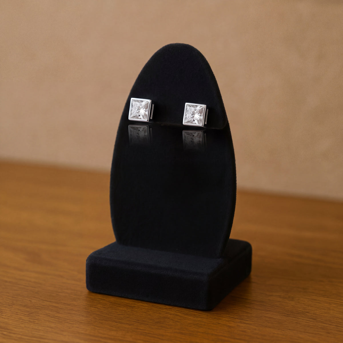 Pair of princess-cut diamond studs in white gold bezels