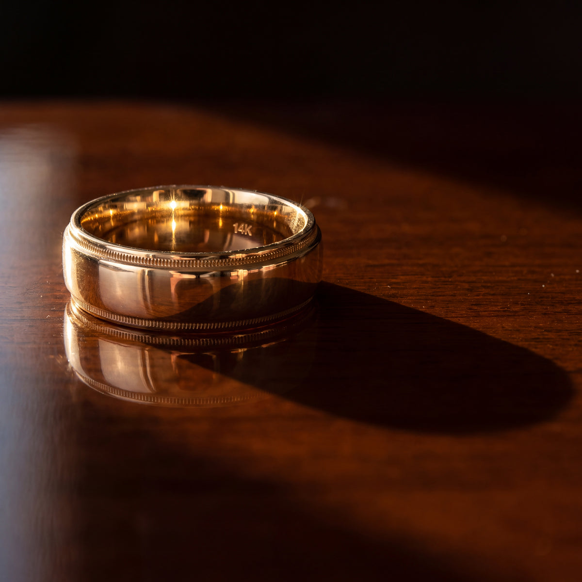 Yellow gold wedding band with milgrain edges