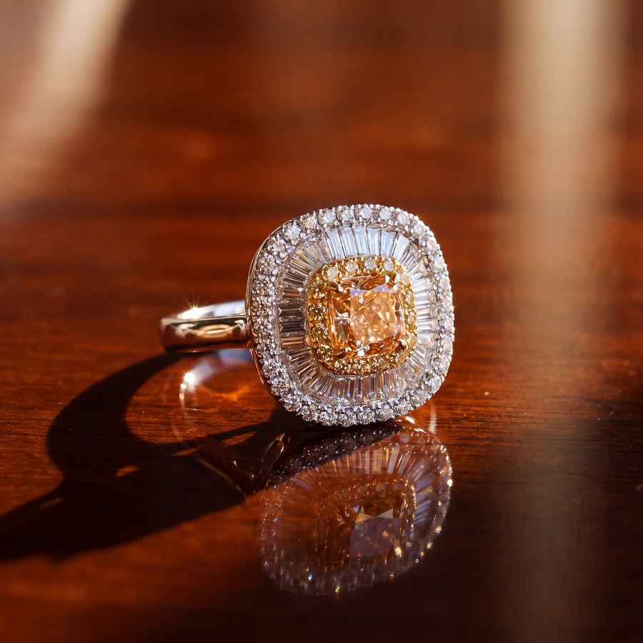Fancy yellow diamond in a double halo of yellow diamonds and baguettes