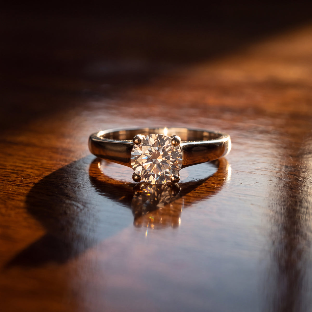 Round diamond solitaire ring in four prongs