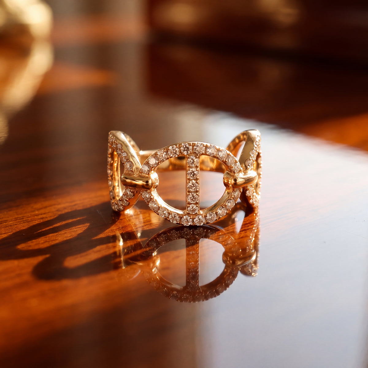 Yellow gold horse bit band with openwork links set in pavé diamonds
