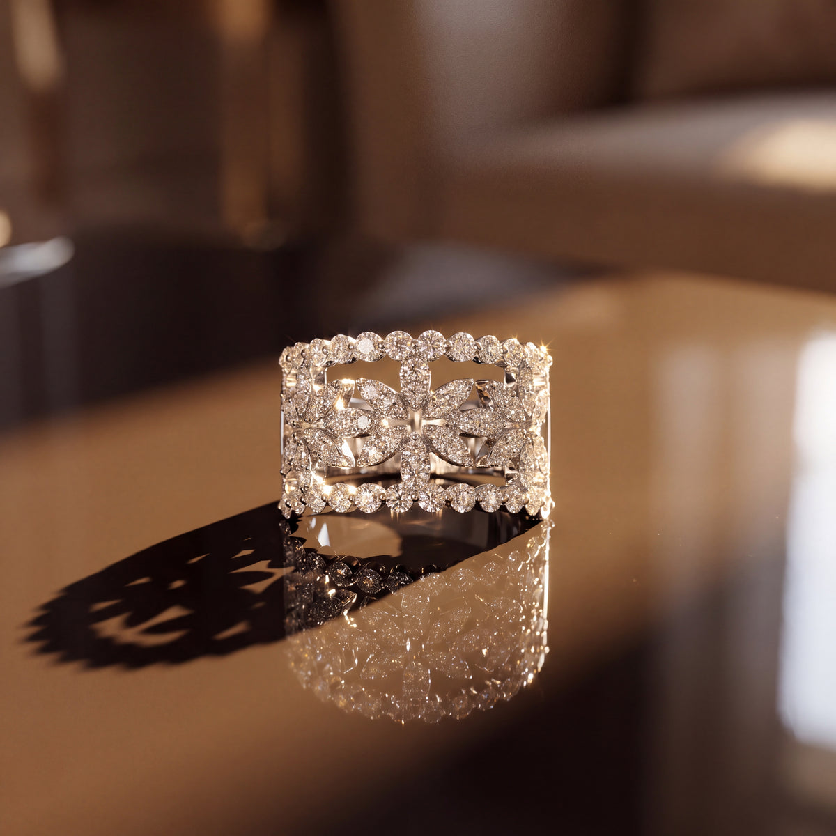 Wide openwork floral band set with diamonds along scalloped edges